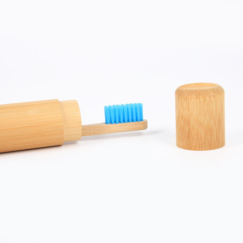 Eco-friendly wooden toothbrush set with blue bristles and bamboo travel case for bathroom storage