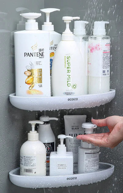Wall-mounted bathroom storage rack holding shampoo and soap bottles in a shower area