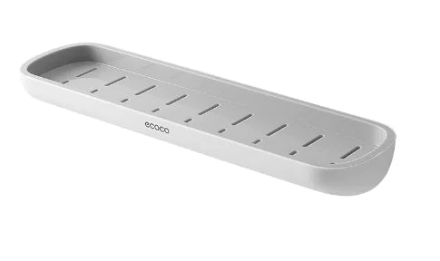 White wall-mounted bathroom storage rack with drainage holes and sleek design