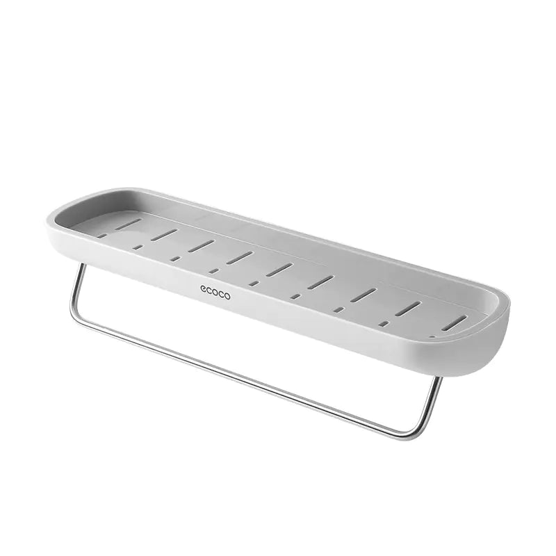 White wall-mounted bathroom storage rack with drainage holes and a metal towel bar