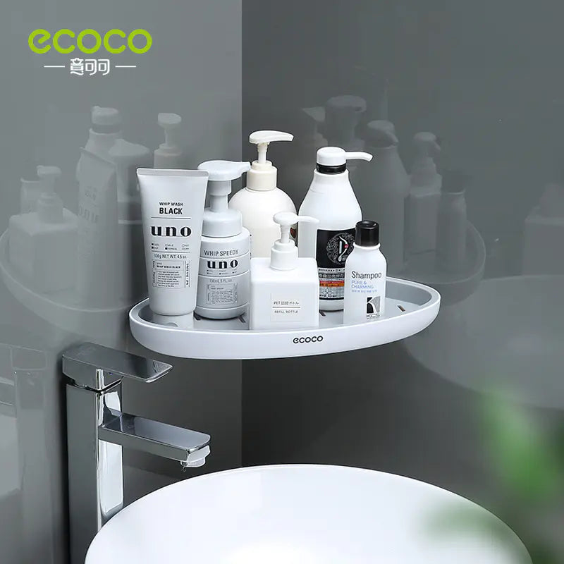 White wall-mounted bathroom storage rack holding shampoo and lotion bottles above sink