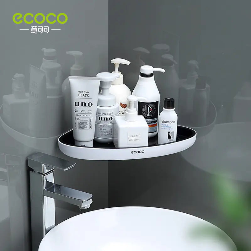 Wall-mounted bathroom storage rack by Ecoco holding shampoo and lotion bottles above a white sink