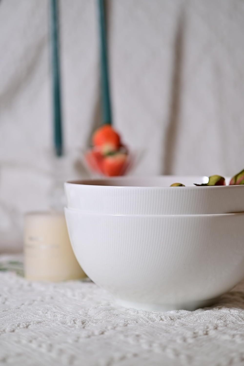 White 8 inch large soup bowl set with textured surface stacked on a lace tablecloth