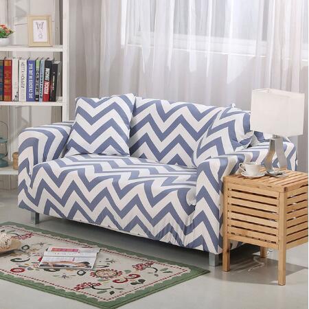 Blue and white chevron pattern elastic sofa cover on loveseat with matching pillows in modern living room