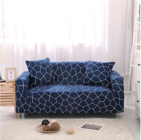 Blue elastic sofa cover with white geometric pattern on a two-seater couch with matching cushions