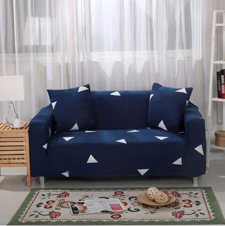 Blue elastic sofa cover with white triangle pattern on a modern two-seater sofa in a bright living room