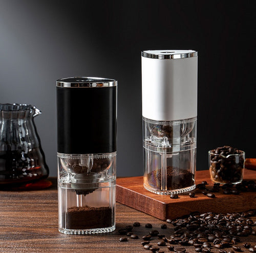 Shopi Vella electric coffee grinder portable in black and white with transparent storage jars and coffee beans
