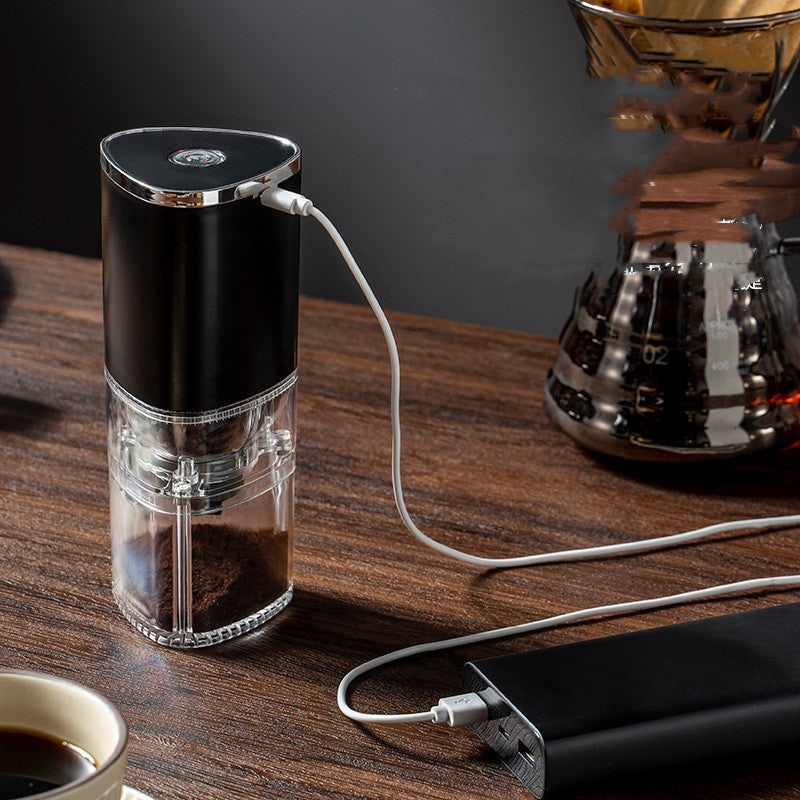 Shopi Vella electric coffee grinder portable with transparent storage jar and USB charging cable on wooden table