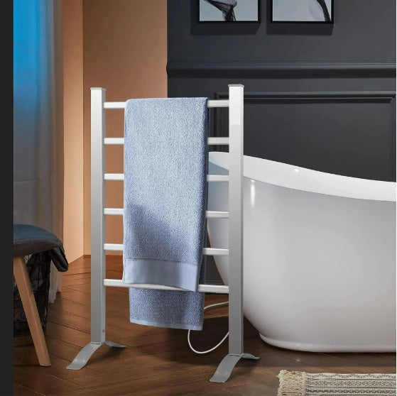 Shopi Vella electric heated towel rack bathroom with silver finish standing near white bathtub