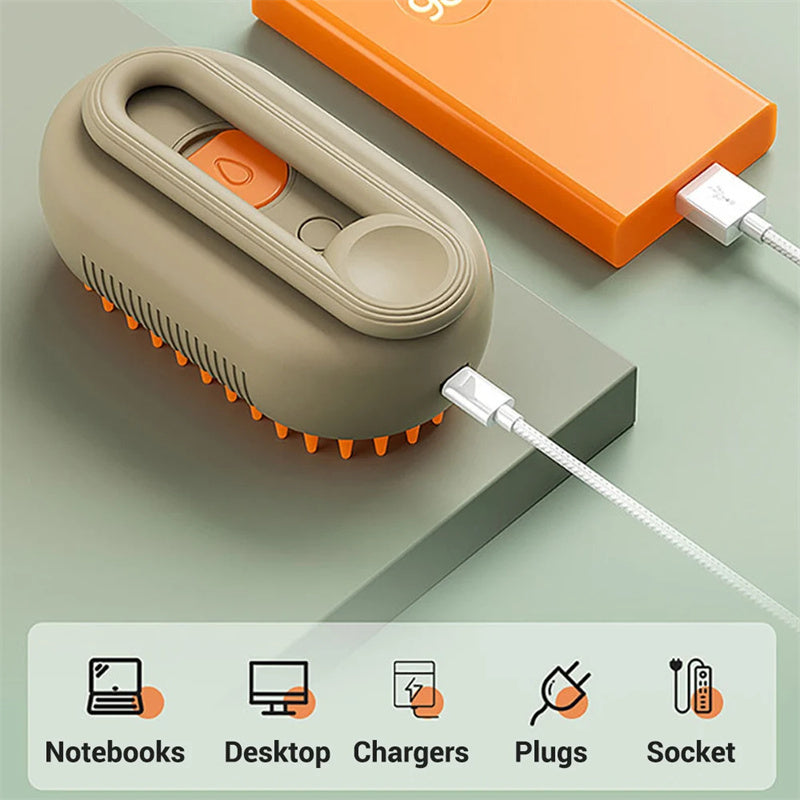 Shopi Vella electric pet grooming brush with orange silicone bristles and USB charging cable