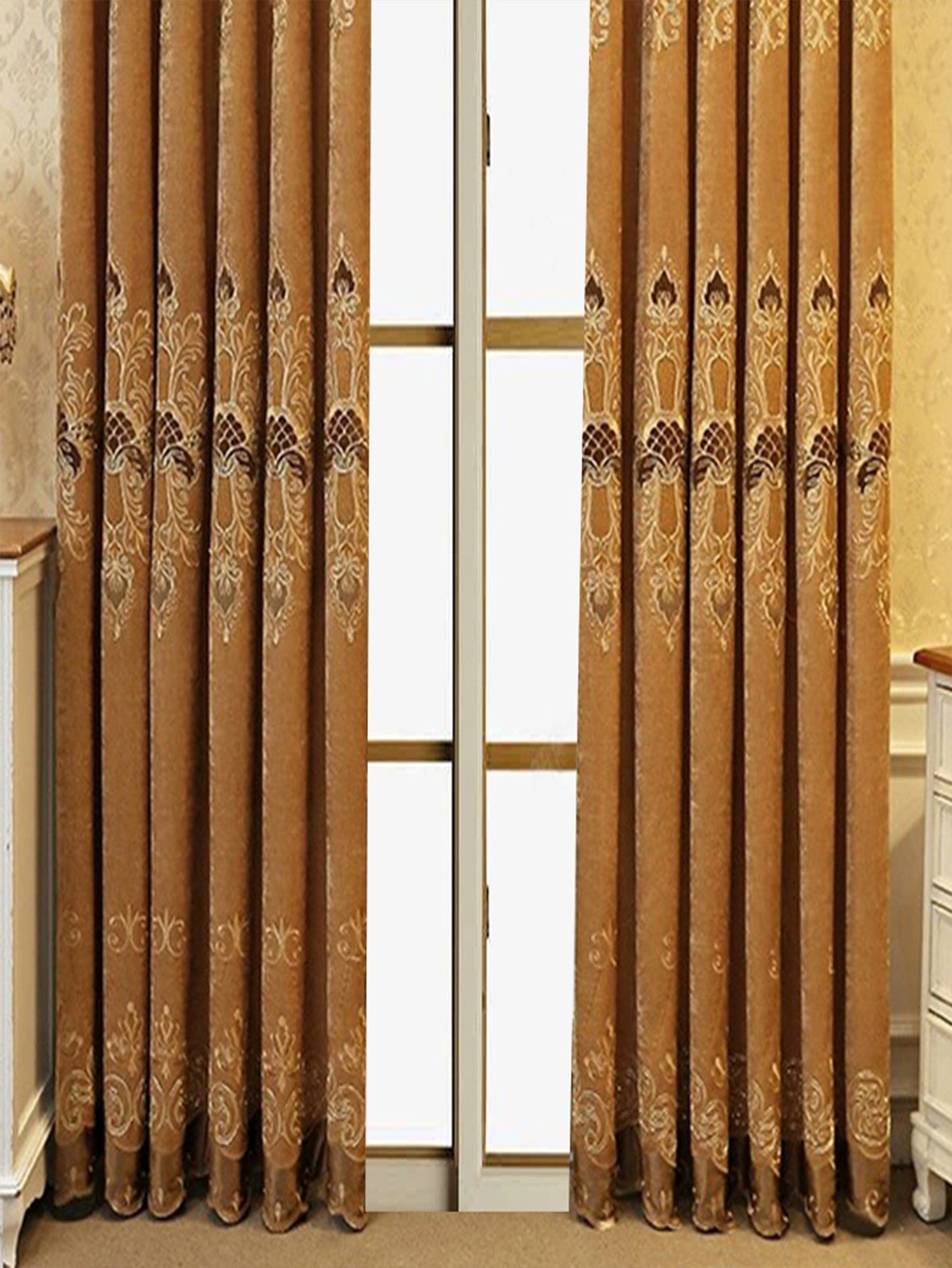 Elegant blackout curtains in warm brown with intricate embroidery draped on either side of a window