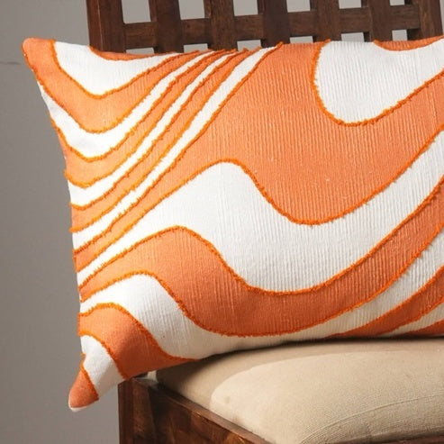 Shopi Vella embroidered throw pillow for living room with orange and white wavy design on wooden chair