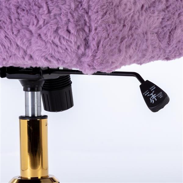 Close-up of adjustment lever and gold base on ergonomic office chair for home with purple fuzzy seat