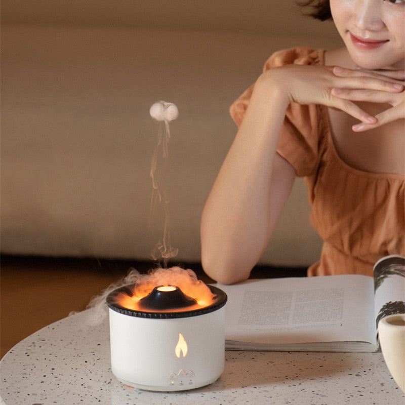 Shopi Vella color changing humidifier with night light emitting mist on table next to woman reading book