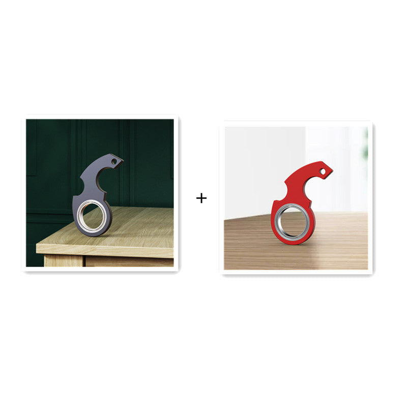 Shopi Vella finger spinner bottle opener in black and red colors on wooden surfaces