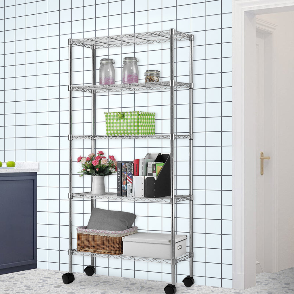 Shopi Vella five tier metal storage rack with wheels holding jars, books, basket, and boxes in a tiled room