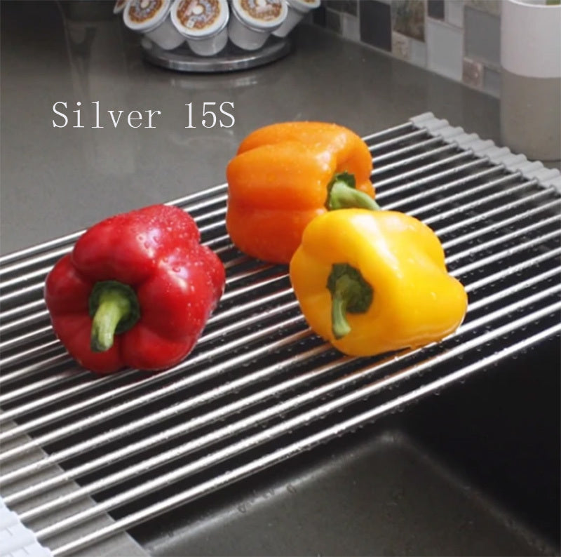 Shopi Vella foldable kitchen sink rack in silver with red, orange, and yellow bell peppers on top