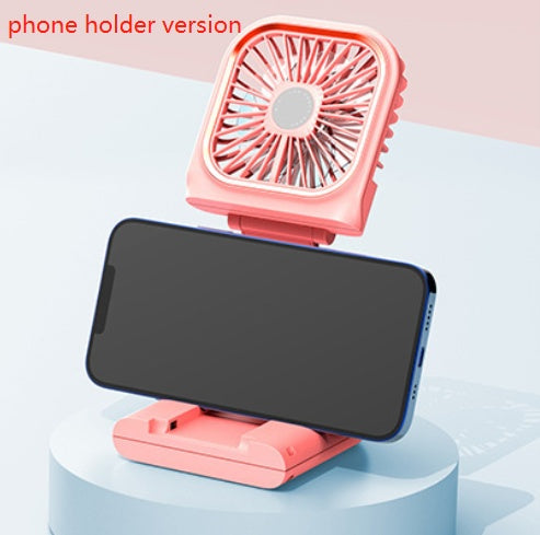 Shopi Vella foldable mini air cooler in pink with phone holder attached on home storage display