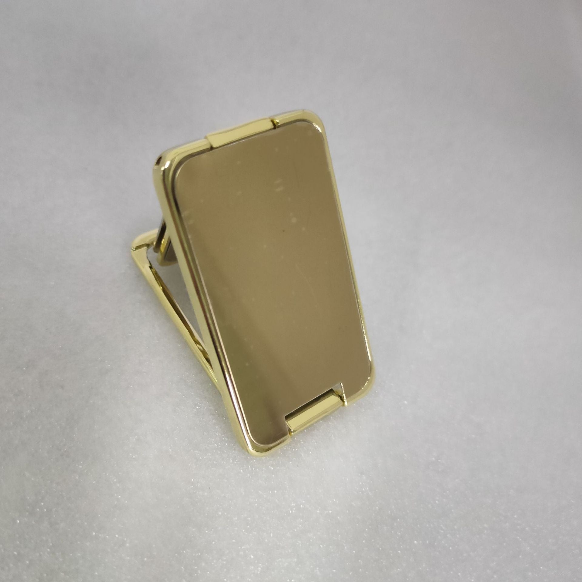 Shopi Vella foldable phone holder stand in gold color for convenient mobile device support