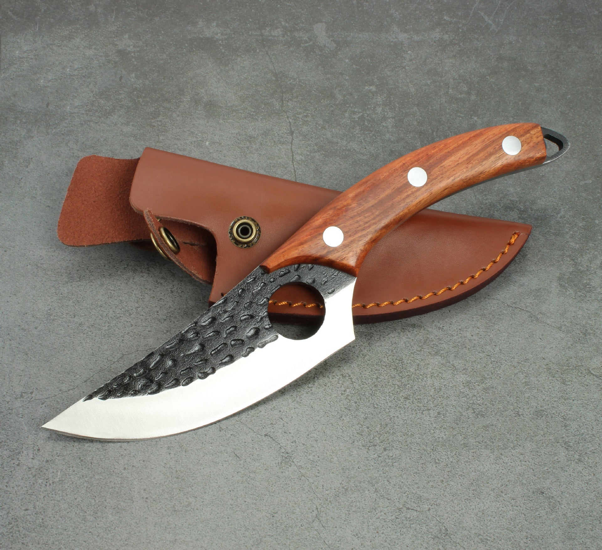 Shopi Vella forged boning knife with wooden handle and textured blade with leather sheath