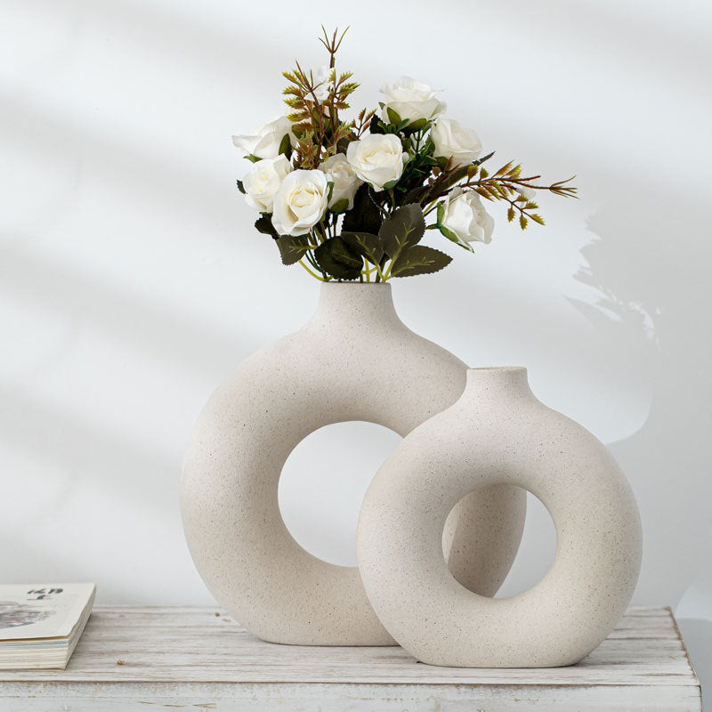 Shopi Vella frosted particle flower arranging vase in round donut shape with white roses on wooden surface