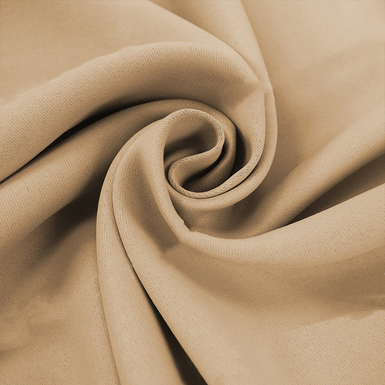 Close-up of beige fabric representing full blackout curtains with liner texture by Shopi Vella