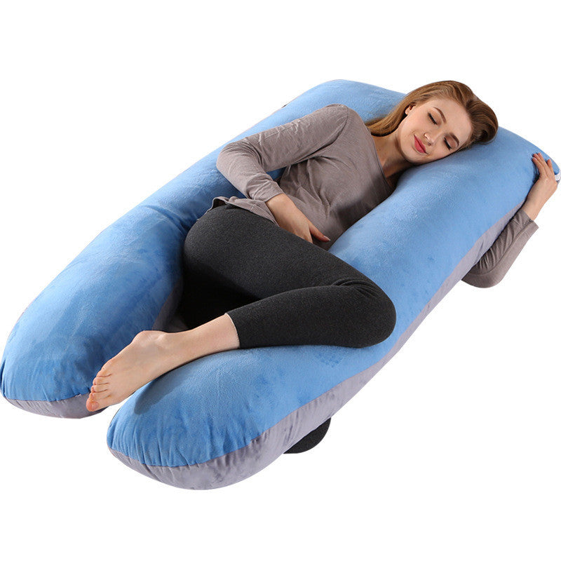 Woman lying comfortably on a blue full body maternity pillow with pillow case from Shopi Vella