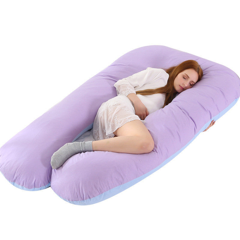 Purple pillow case for full body maternity pillow with woman resting comfortably