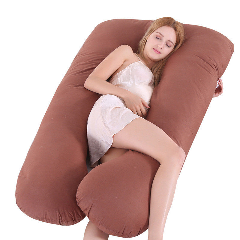 Shopi Vella pillow case on a brown full body maternity pillow with a woman resting comfortably