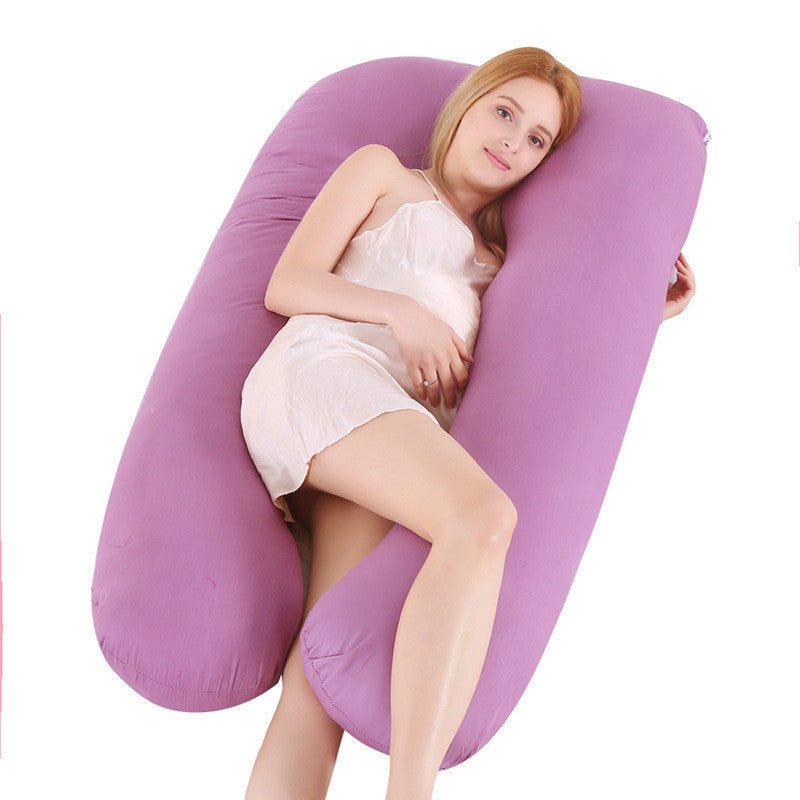 Shopi Vella purple pillow case on full body maternity pillow with woman resting comfortably