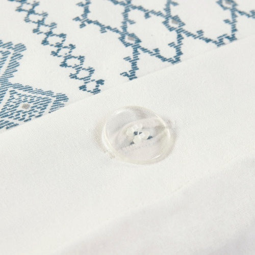 Close-up of full queen duvet cover with chenille showing white fabric, blue pattern, and clear button detail