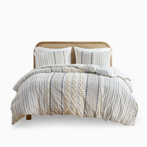 Full queen duvet cover with chenille in neutral tones on bed with matching pillow shams