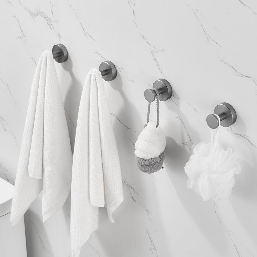 Shopi Vella furniture hardware coat hooks with screws holding towels and bath accessories on marble bathroom wall