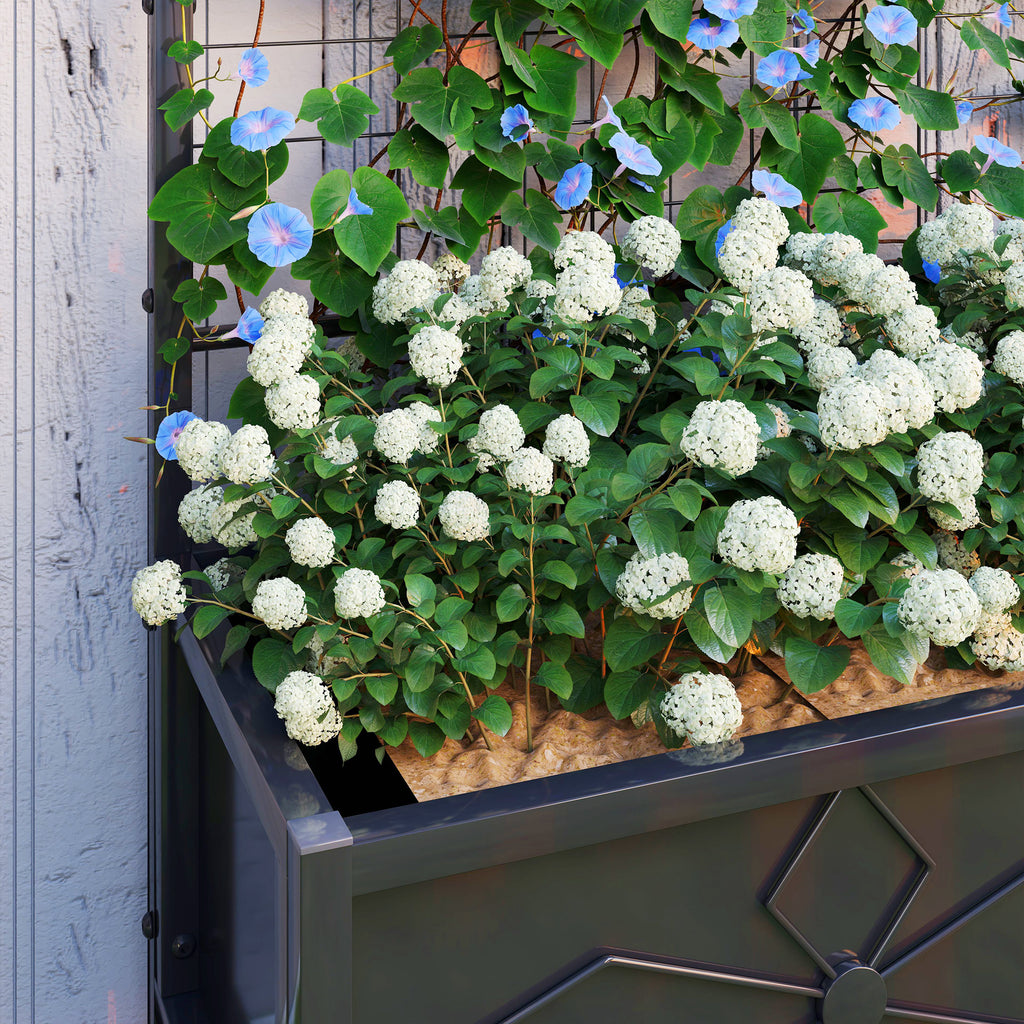 Shopi Vella galvanized raised garden bed with blooming white and blue flowers for outdoor gardening