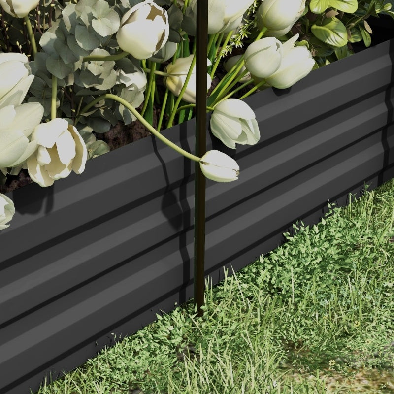 Shopi Vella black herb and veggie raised garden box with white flowers and green grass