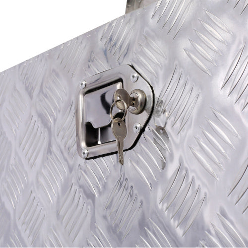 Close-up of lock and keys on a 30 inch aluminum toolbox with textured metal surface