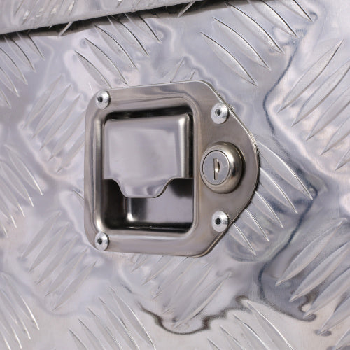 Close-up of handle and lock on 39 inch aluminum truck tool box by Shopi Vella with diamond plate texture