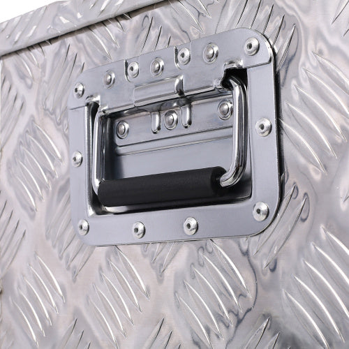 Close-up of handle on 39 inch aluminum truck tool box with diamond plate pattern by Shopi Vella