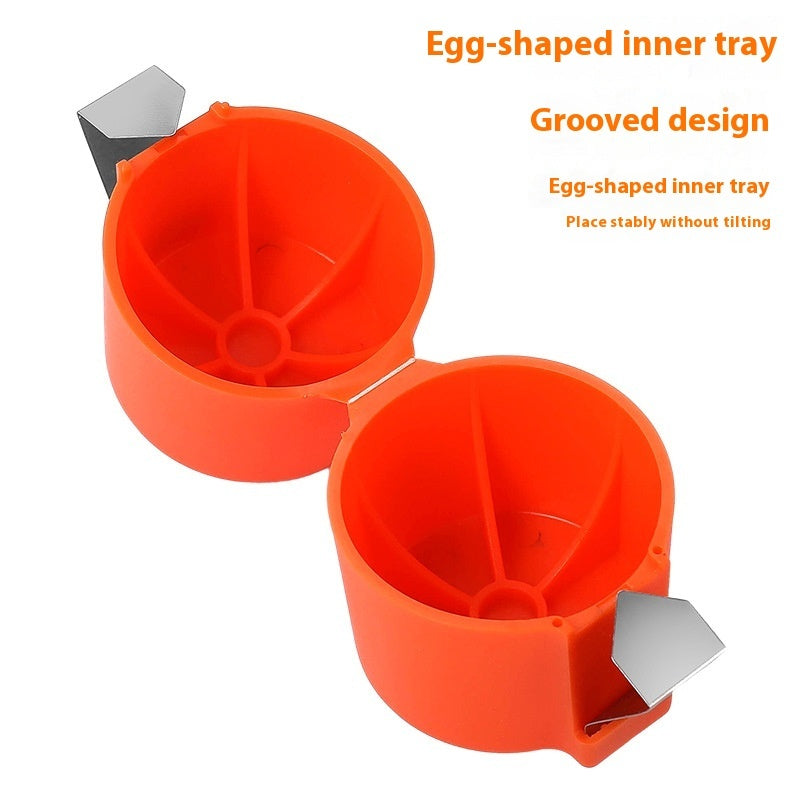 Shopi Vella orange egg shell opener tool with egg-shaped inner tray and grooved design