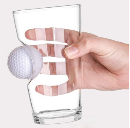 Shopi Vella golf beer mug with a built-in golf ball holder in clear glass held by a hand