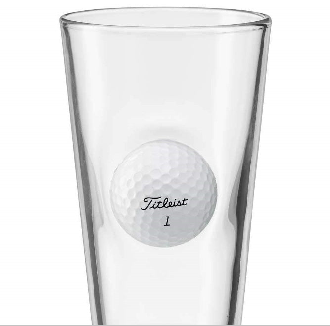 Clear glass golf beer mug with embedded Titleist golf ball design by Shopi Vella