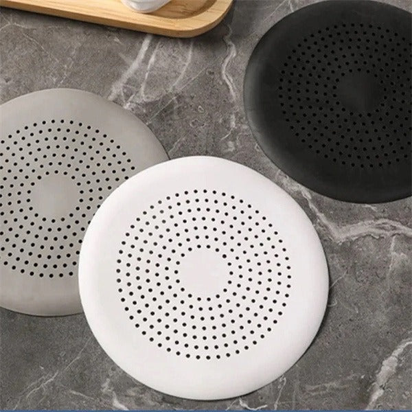 Shopi Vella kitchen sink hair filter in black gray and white silicone with perforated design for home storage
