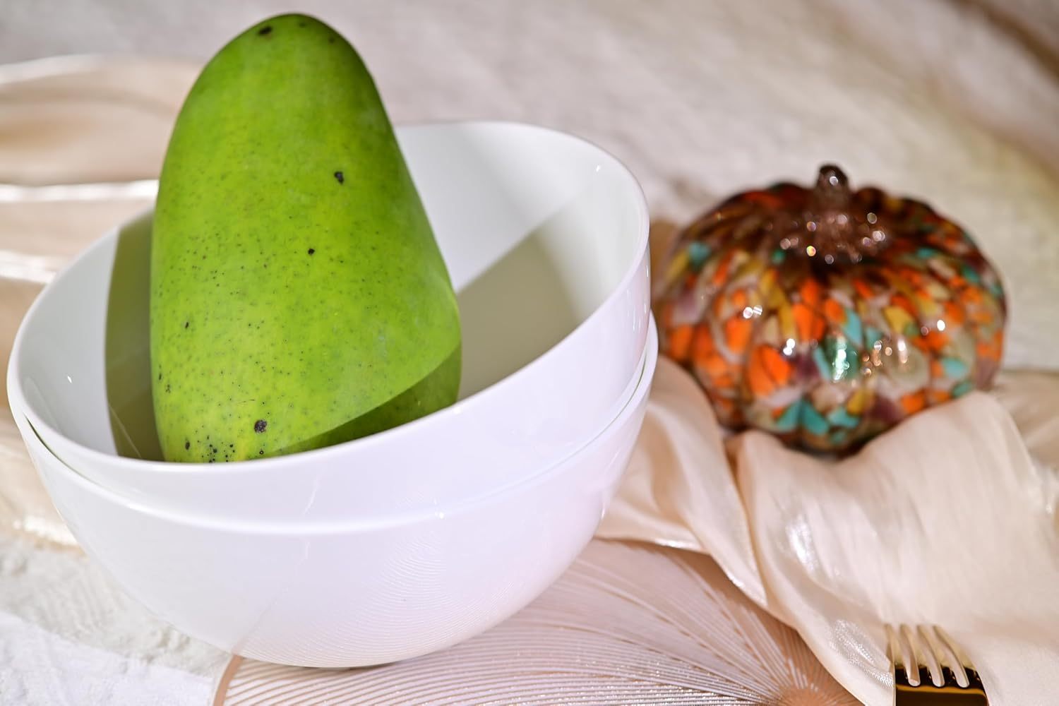 Shopi Vella large deep cereal bowl set with white bowls stacked and a green mango inside