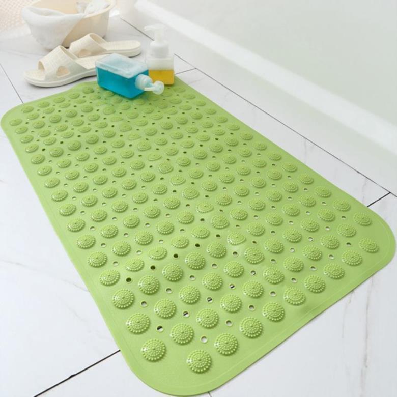 Shopi Vella green non-slip bathroom floor mat with textured surface placed on white tile floor