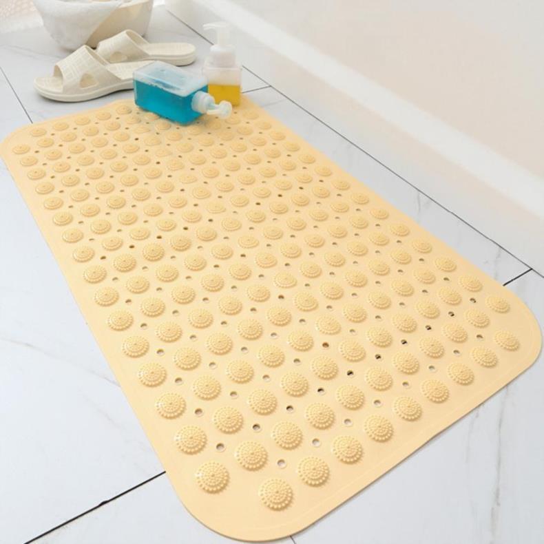 Shopi Vella beige non-slip bathroom floor mat with suction cups on white tile floor