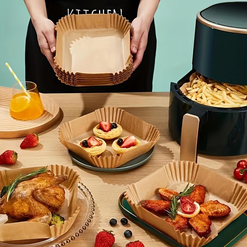 Shopi Vella non-stick air fryer paper 100 pack used in air fryer basket with fried chicken, wings, and desserts