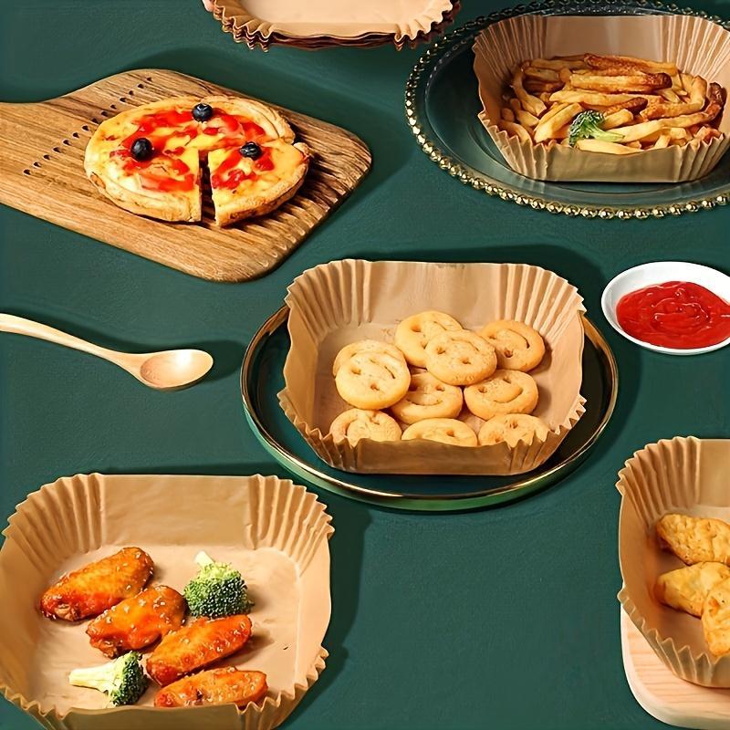 Shopi Vella bakeware with non-stick air fryer paper 100 pack holding fries, pizza, chicken wings, and snacks