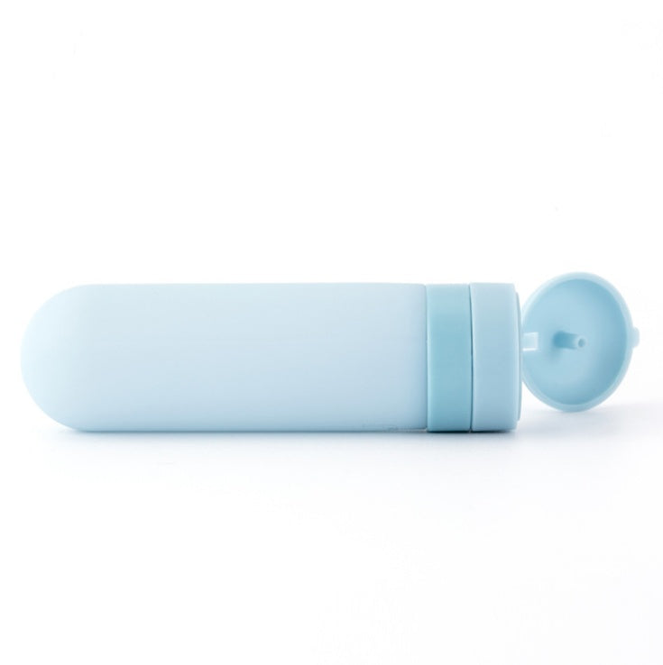 Light blue silicone travel bottles with flip-top caps for easy liquid storage and portability