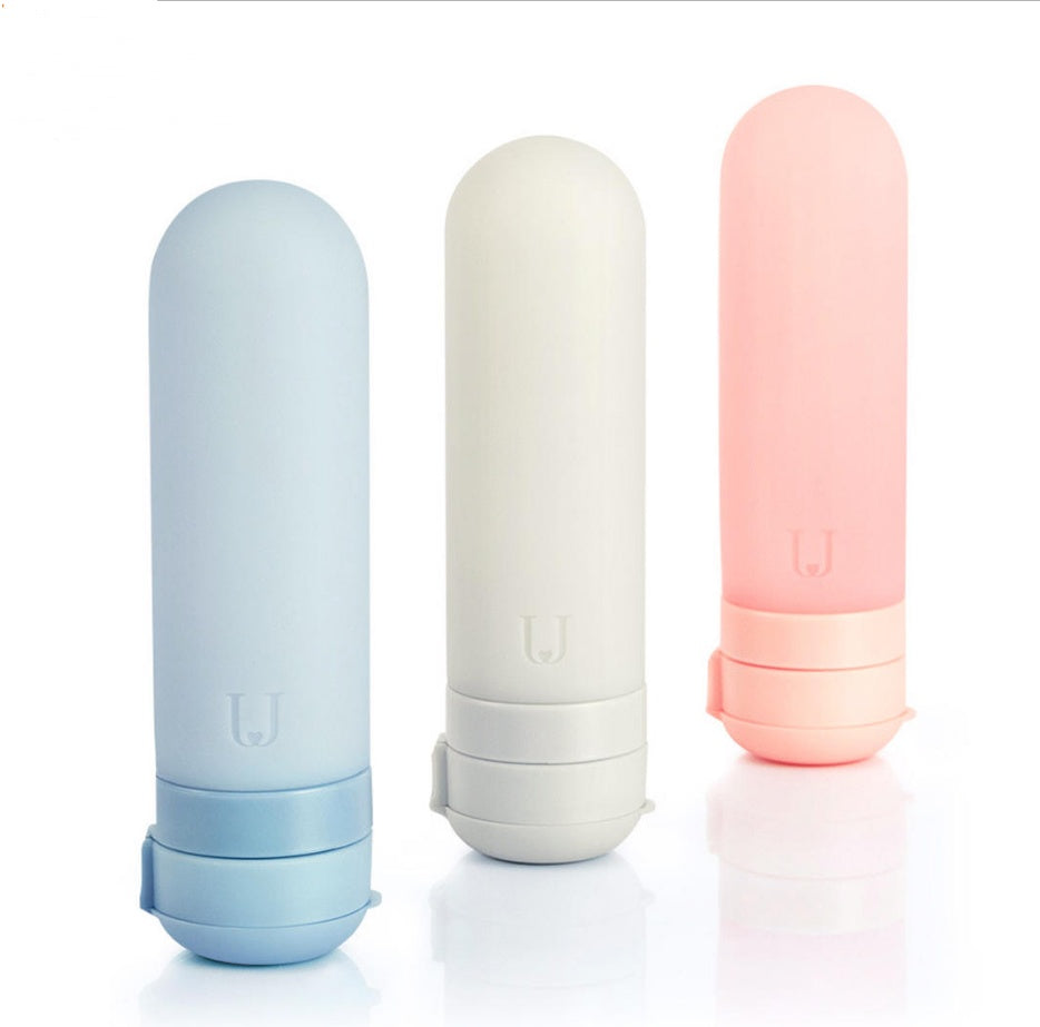 Shopi Vella silicone travel bottles set in blue white and pink for convenient liquid storage