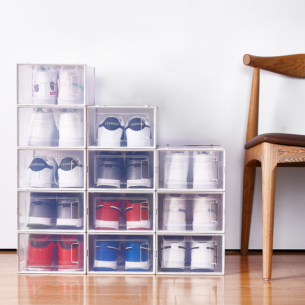 Shopi Vella stackable shoe storage boxes neatly arranged with various sneakers inside near a wooden chair
